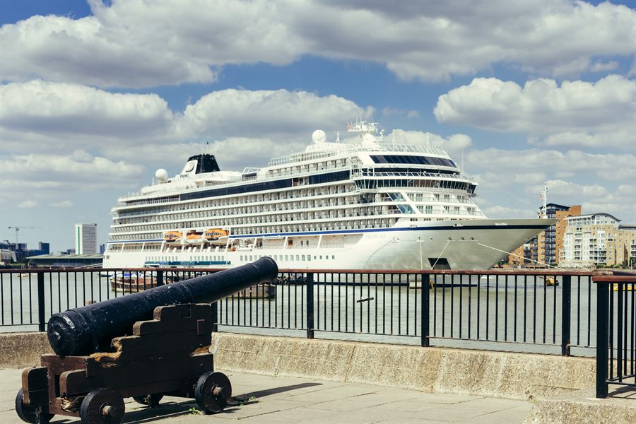 Ocean cruise ship towering over a promenade