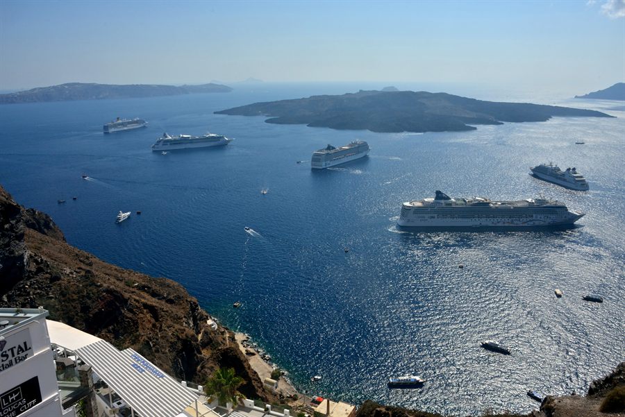 Ocean cruise ships at anchor with tenders